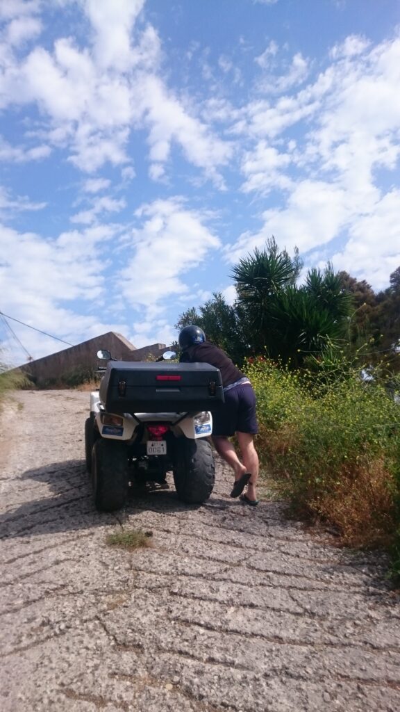 pushing the quad up a hill greece